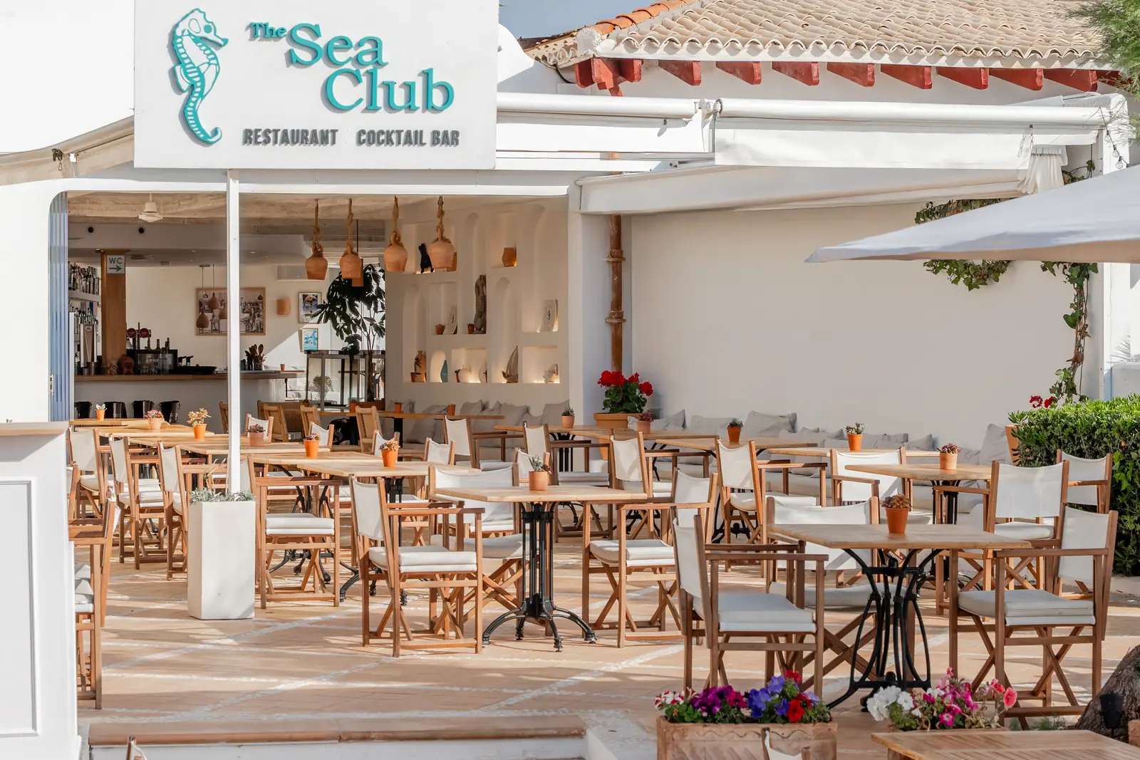 Facade and terrace of The Sea Club on the seafront of Cala Ratjada, Capdepera